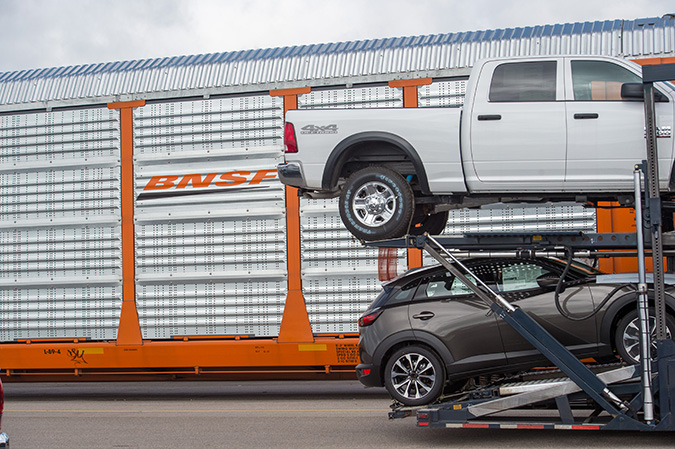 A BNSF autorack car used to carry vehicles is loaded at our auto facility in Pearland, Texas. A BNSF autorack car used to carry vehicles is loaded at our auto facility in Pearland, Texas.