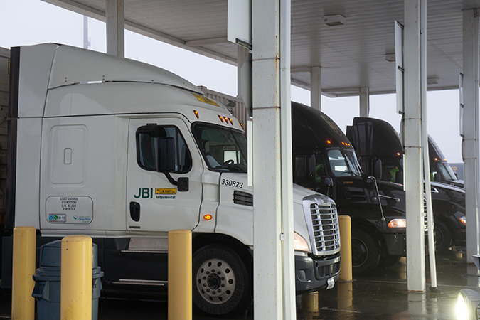 Trucks enter a BNSF intermodal facility, aided by AGS technology. Trucks enter a BNSF intermodal facility, aided by AGS technology.