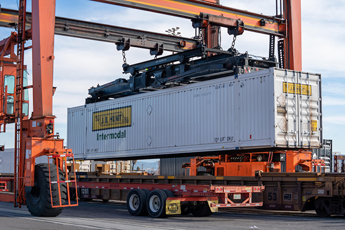 An RTG crane moves a J.B. Hunt container at BNSF’s San Bernardino Intermodal Facility in California. An RTG crane moves a J.B. Hunt container at BNSF’s San Bernardino Intermodal Facility in California.