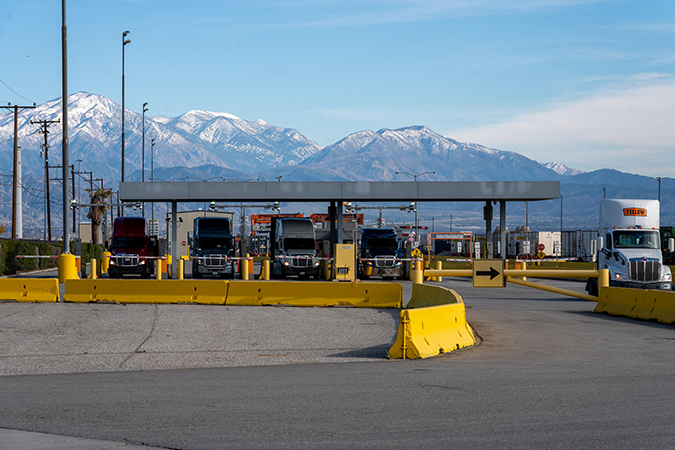 Trucks bring containers in through the front gate of San Bernardino Intermodal Facility. Trucks bring containers in through the front gate of San Bernardino Intermodal Facility.