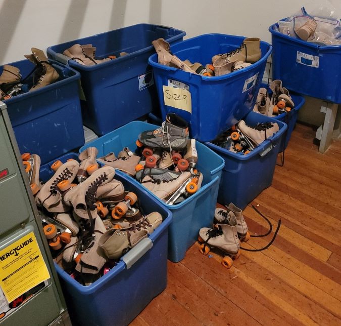 Bins of skates needing repair Bins of skates needing repair
